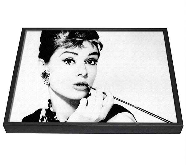 A picture of a Audrey Hepburn Cigarette 1 framed canvas print sold by Wallart-Direct.co.uk