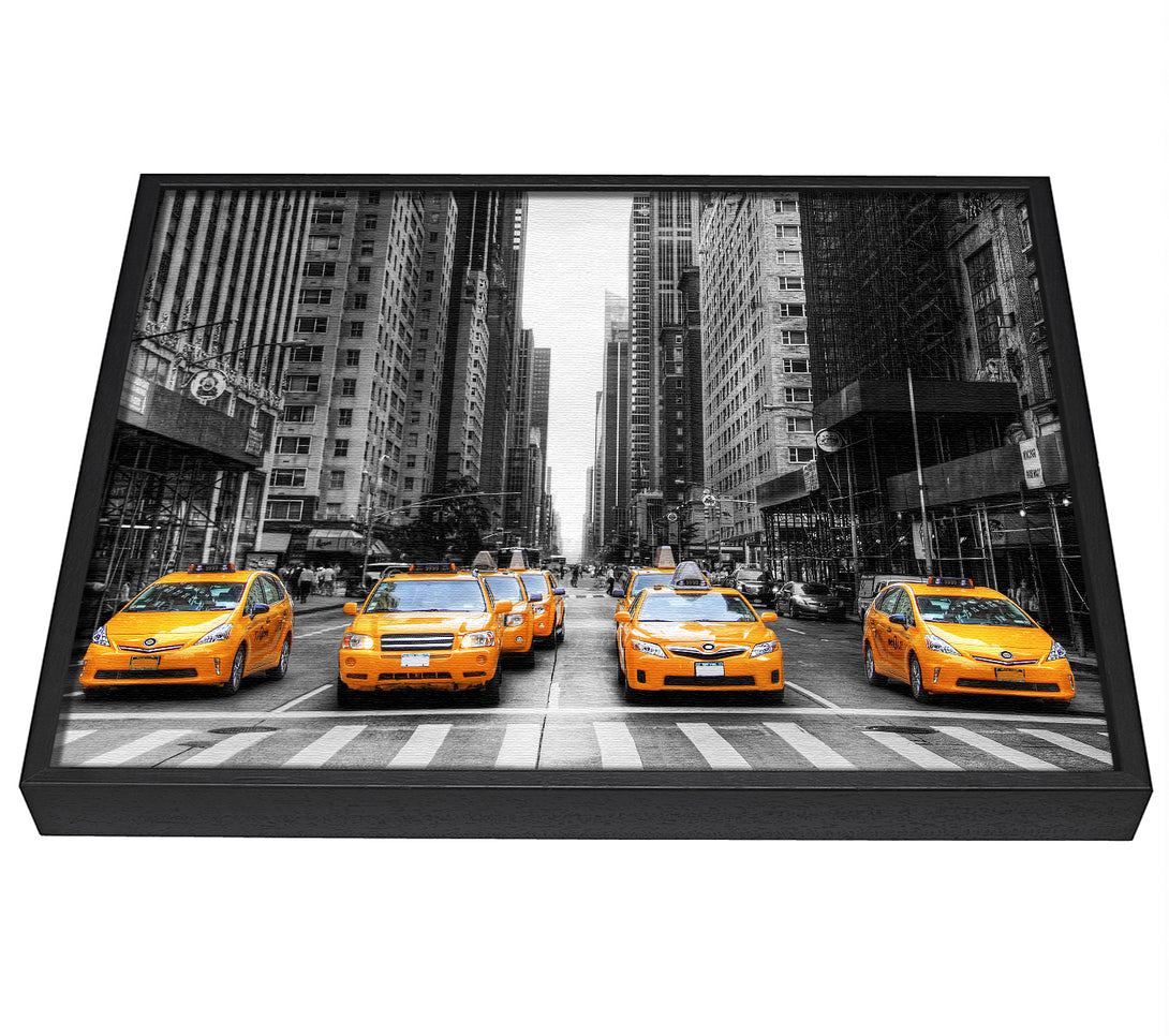 A picture of a Yellow Cab Line Up Streets framed canvas print sold by Wallart-Direct.co.uk