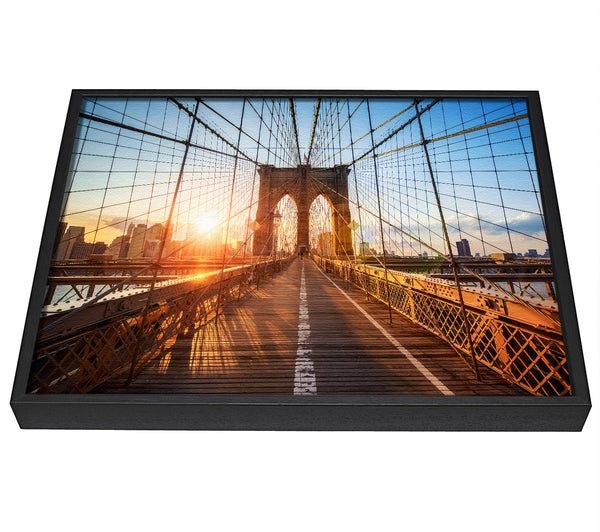 A picture of a Sunset Through Brooklyn Bridge framed canvas print sold by Wallart-Direct.co.uk