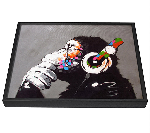 A picture of a Chimp Headphones Thinking framed canvas print sold by Wallart-Direct.co.uk