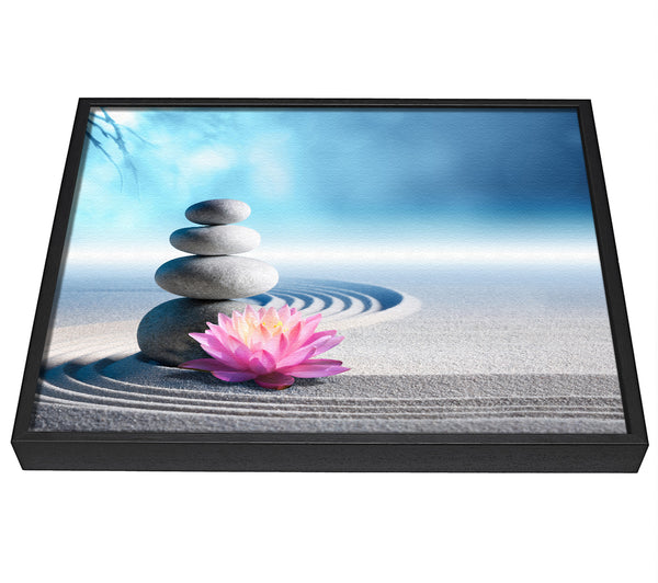 A picture of a pebbles on zen beach lilly framed canvas print sold by Wallart-Direct.co.uk