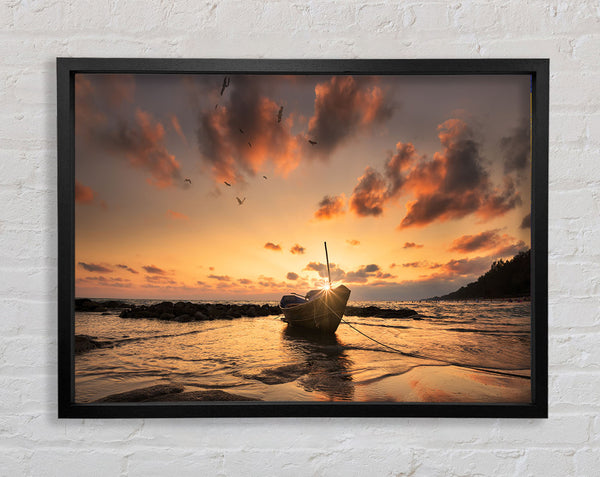 Sunset finishing boat on the beach