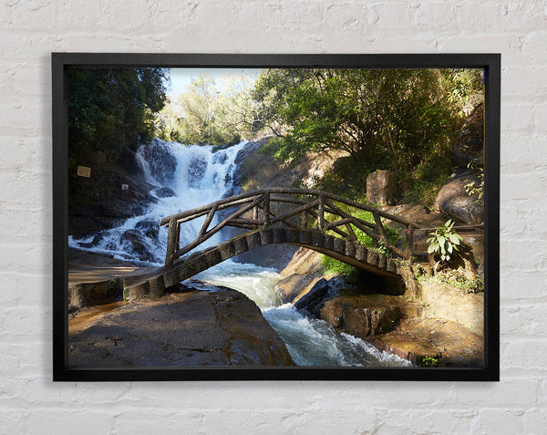 Rustic made bridge by a waterfall