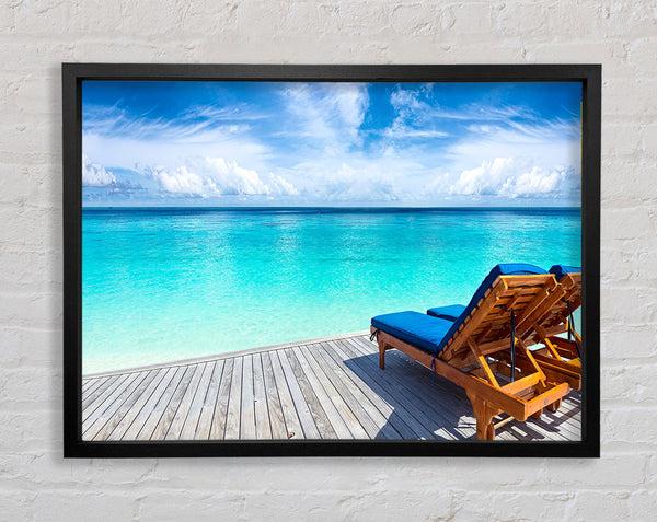 sunchairs on decking on the beach