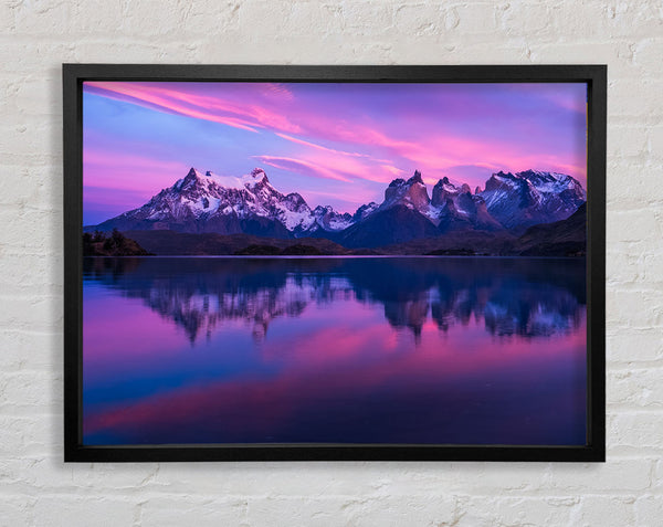 Purple and blue mountains above lake