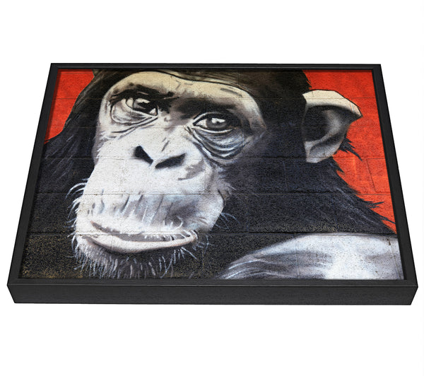 A picture of a The Chimp On Red framed canvas print sold by Wallart-Direct.co.uk