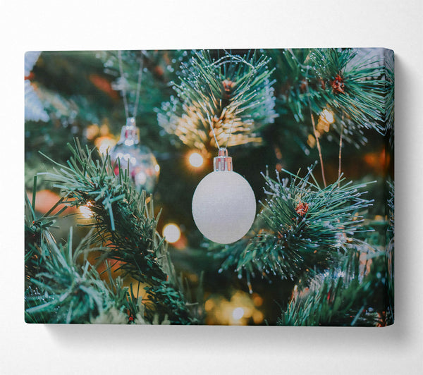 White Ornament On Green Tree