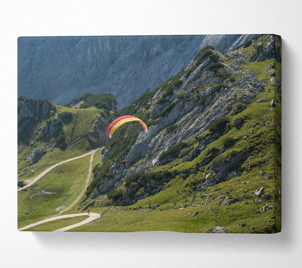 Yellow Paraglider Above Mountains