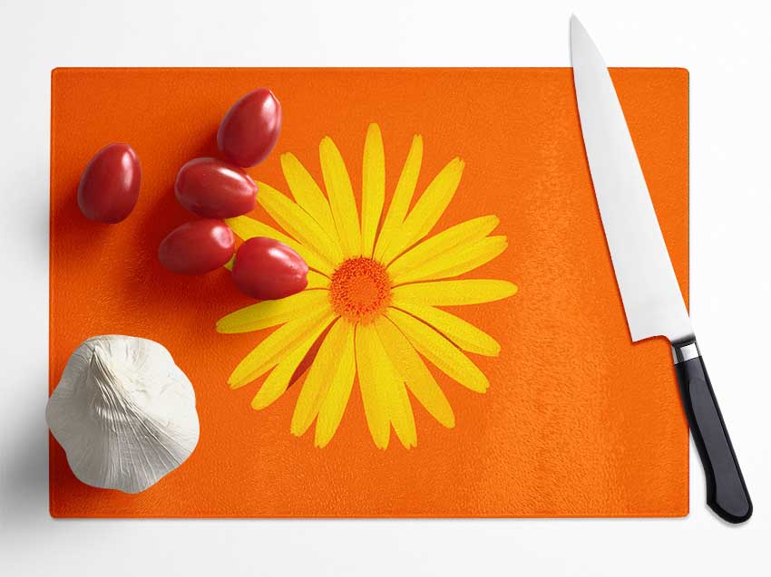 Yellow Daisy Face On Orange Glass Chopping Board