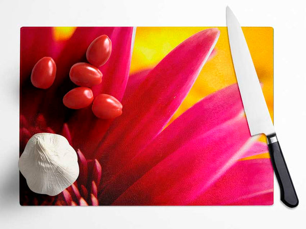 Vibrant Pink Petals On Yellow Glass Chopping Board