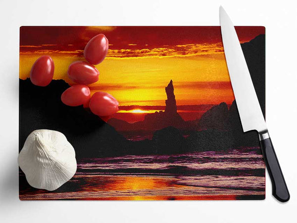 Tranquil Orange Ocean Rocks Glass Chopping Board