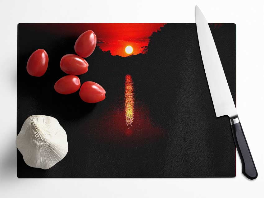 As The Stunning Red Sun Goes Down Glass Chopping Board