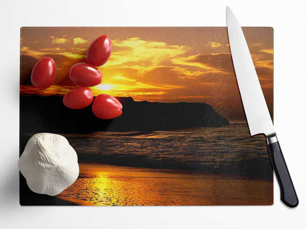 Sunrise Over Ocean Rocks Glass Chopping Board