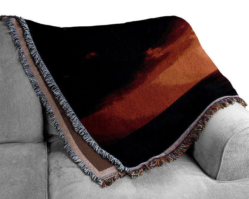 Sunset Through The Black Ocean Clouds Woven Blanket