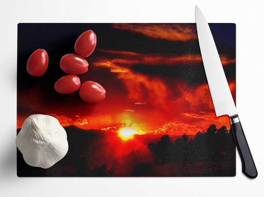 Vibrant Red Sun Clouds Glass Chopping Board