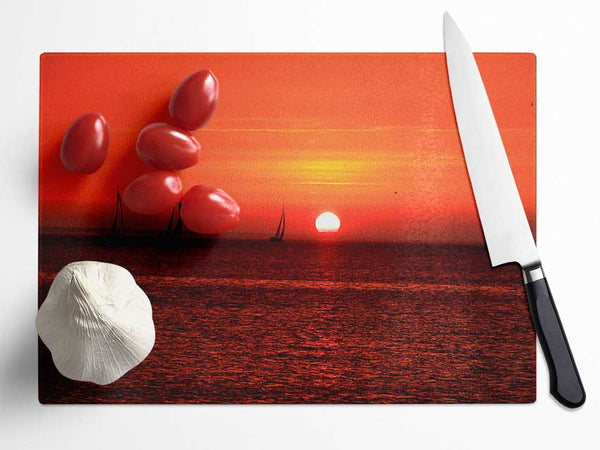 Sunset Boats In The Ocean Glass Chopping Board