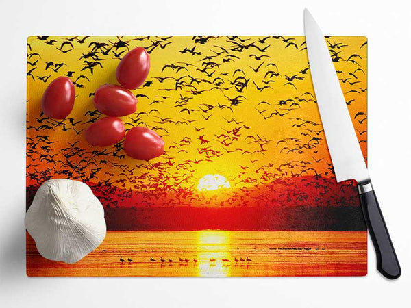 The Birds In The Golden Sunset Glass Chopping Board