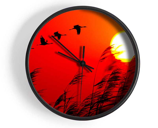 Geese In Flight Under The Red Sun Clock - Wallart-Direct UK