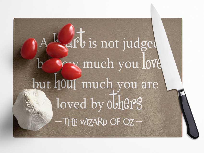 Movie Quote Wizard Of Oz A Heart Is Not Judged Beige Glass Chopping Board