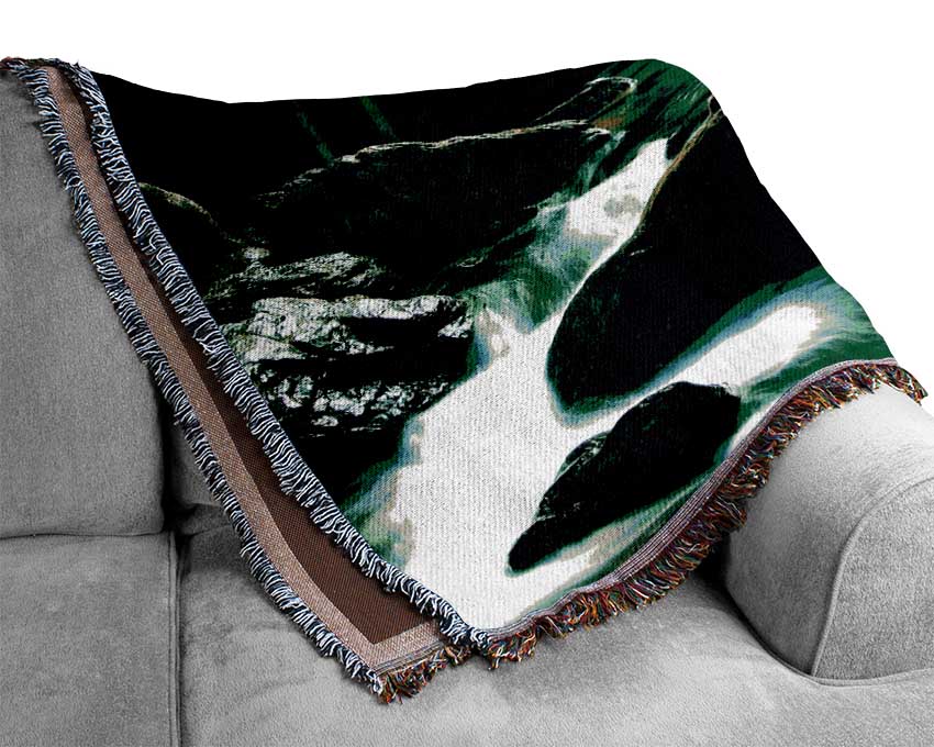 The Waterfall Flows Over The Rocks Woven Blanket