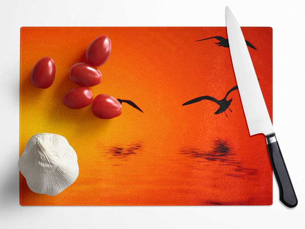 Orange Ocean Flight Glass Chopping Board