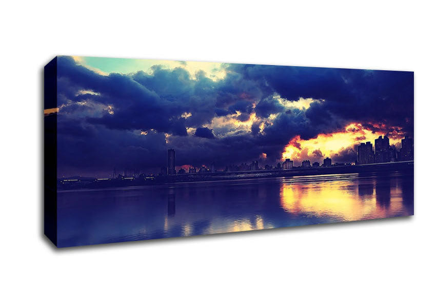 Picture of As The Sunset Beaks Through Over The City Panoramic Canvas Wall Art