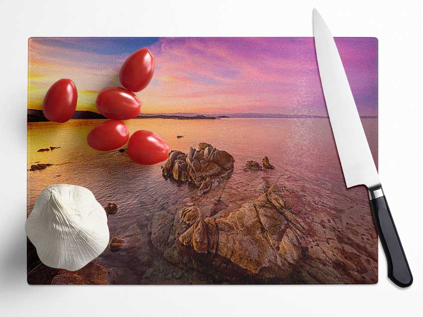 Pink Skies Over The Ocean Rocks Glass Chopping Board