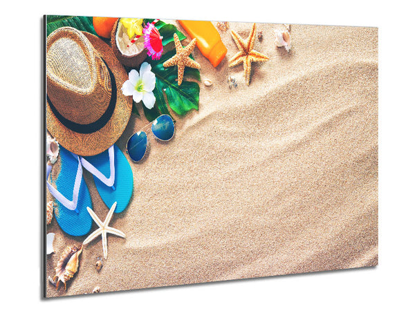 Sunglasses and hat on the beach