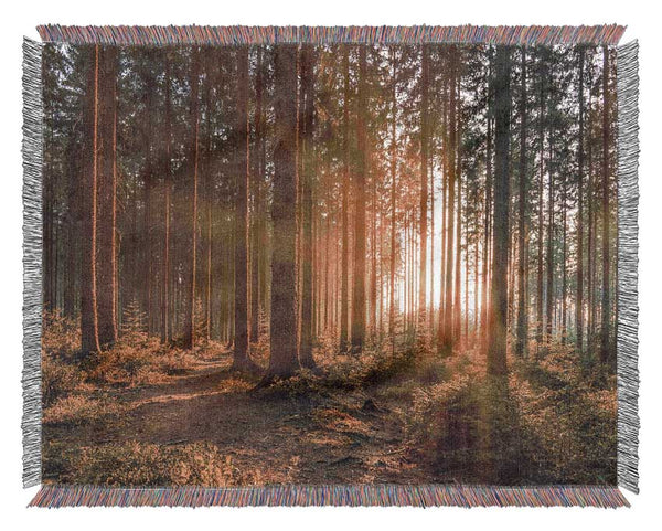 Sunset through the british trees Woven Blanket