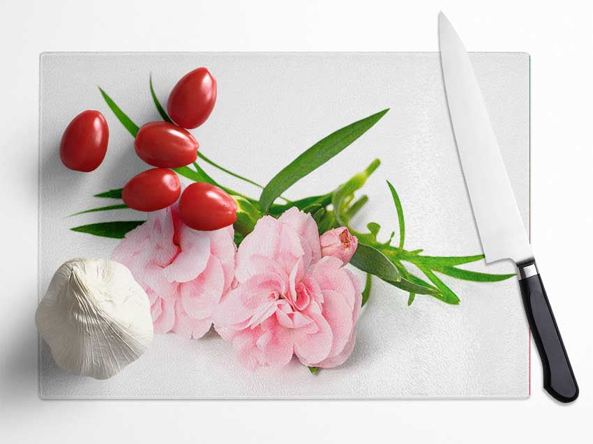 Pink flowers laid out Glass Chopping Board