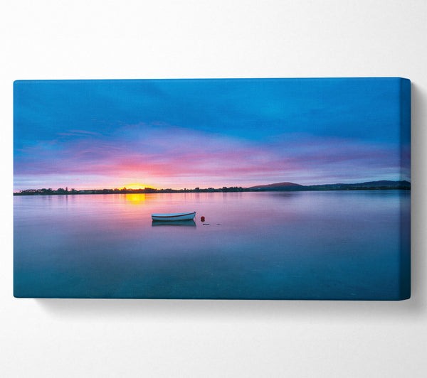 Small row boat on calm lake