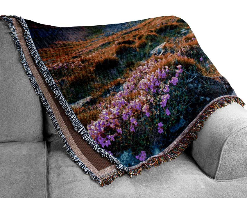 Beautiful mountain range and flowers Woven Blanket