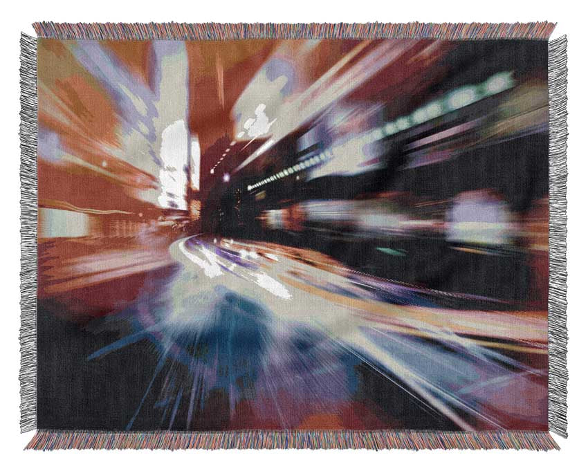 City in a blur colourful light Woven Blanket