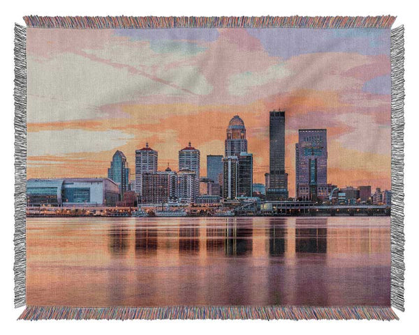 Orange sunset in the city shoreline Woven Blanket