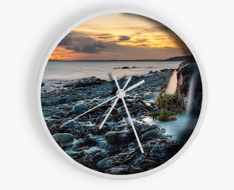 Water flows down the rocks into the sea Clock - Wallart-Direct UK