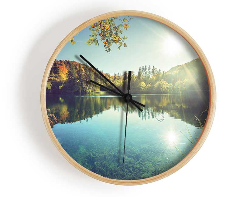 View of the lake through the branches Clock - Wallart-Direct UK