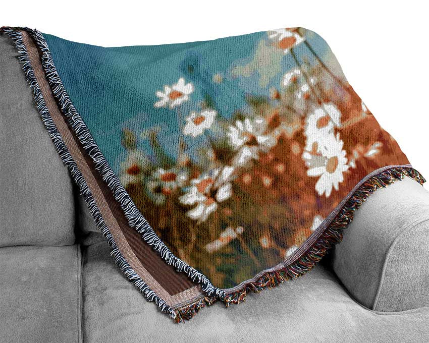 Butterfly landing on a daisy Woven Blanket