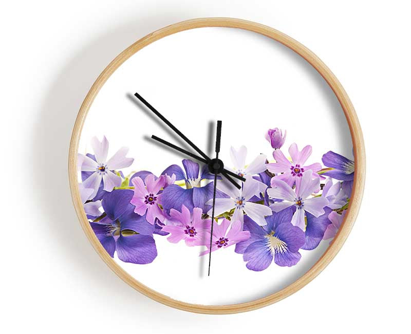 Pink and violet flowers laid out Clock - Wallart-Direct UK