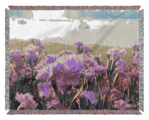 Pink flowers in the countryside Woven Blanket