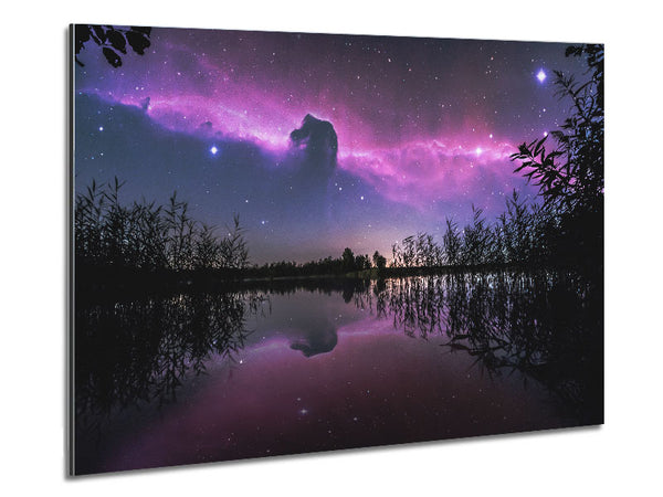 Horse head nebula over a purple lake