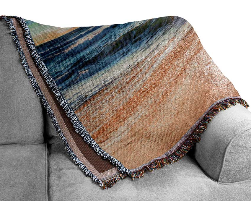 Crashing blue waves on the shore Woven Blanket