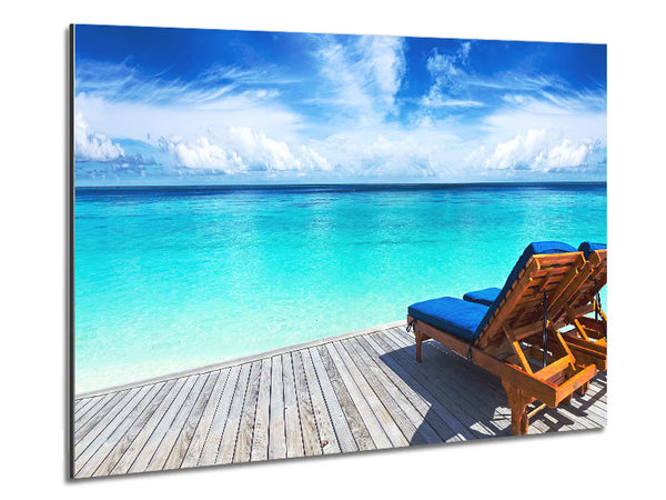 sunchairs on decking on the beach