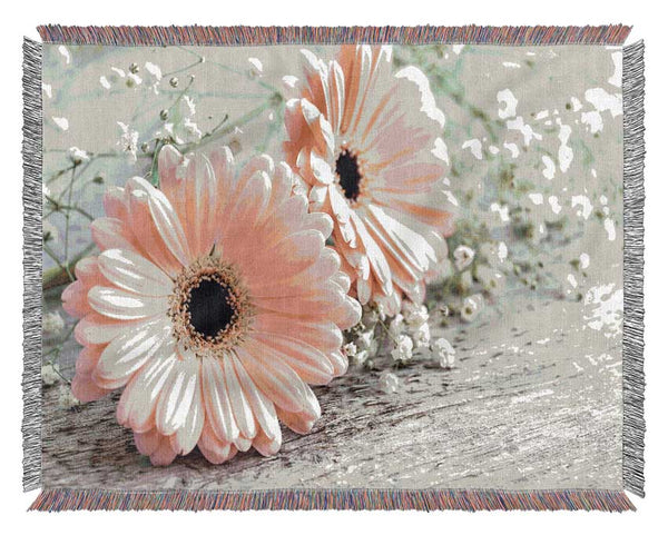 Pink gerbera laying down close Woven Blanket