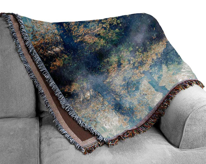 Blue hue bridge on lake Woven Blanket