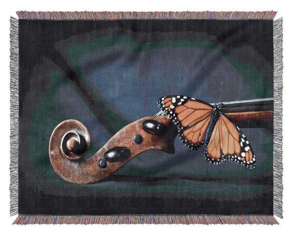 Butterfly resting on Instrument Woven Blanket