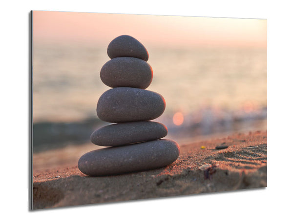 Zen stones stacked up on beach