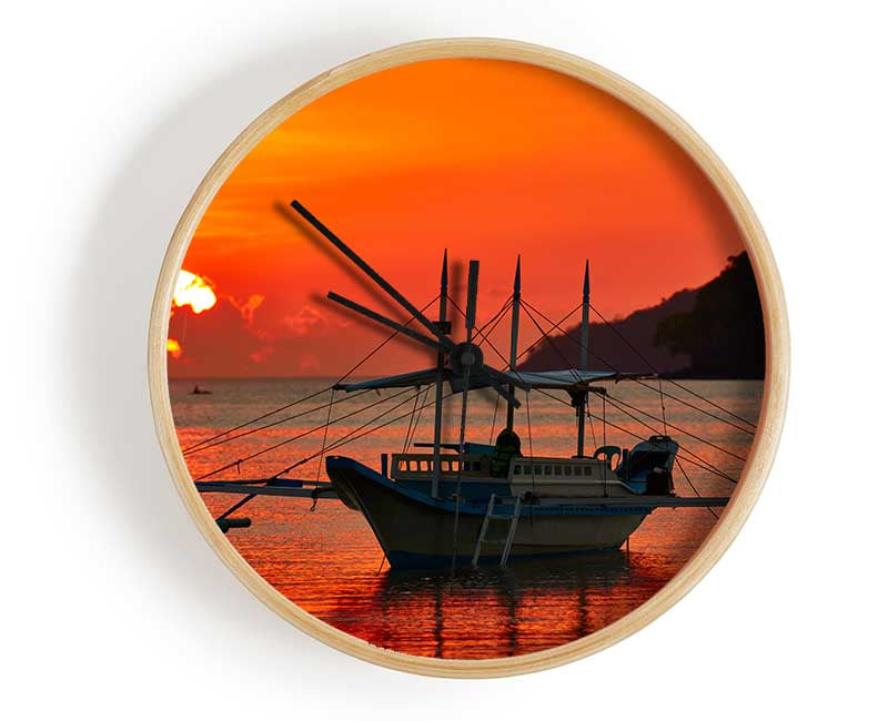 Boat sailing in the orange sunset Clock - Wallart-Direct UK