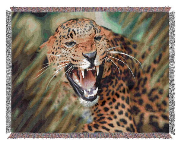 Fierce leopard in the grass Woven Blanket