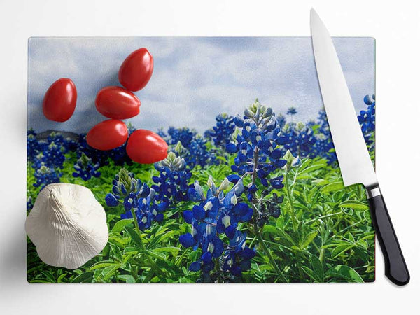 Bue flowers on green stems Glass Chopping Board