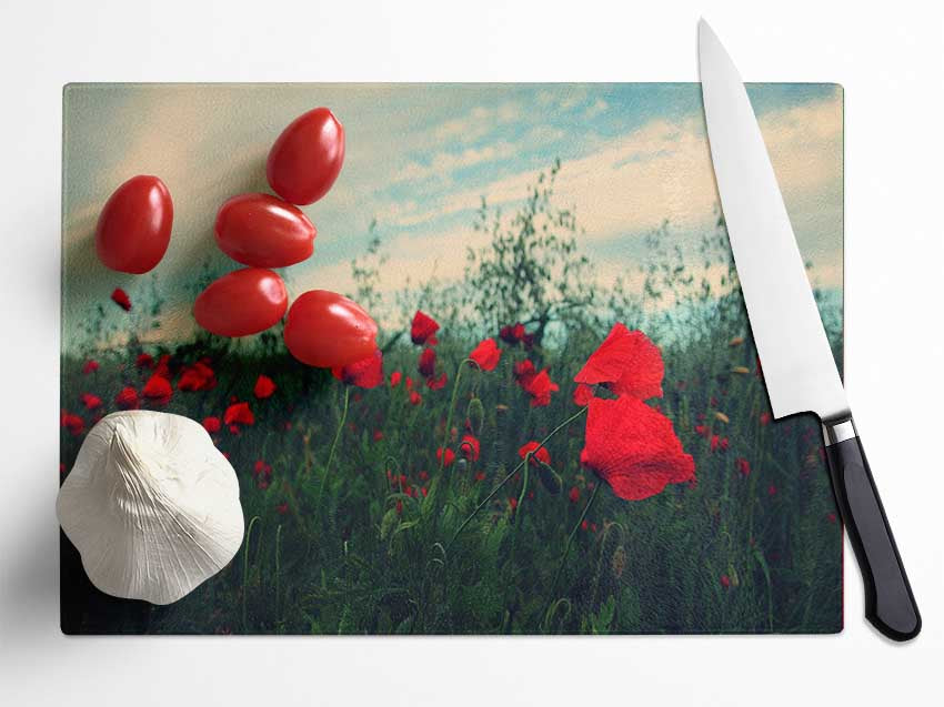 Red poppies on a windy day Glass Chopping Board